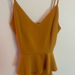 Strap Tank top type, flowy bottom, back is open